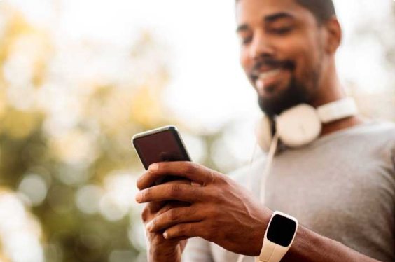 a young man interacting with his smartphone