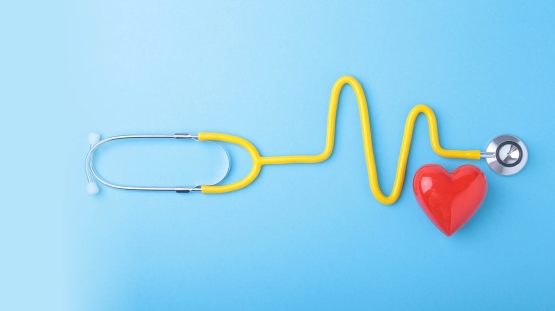 American Heart Month_555x311 Heart and stethoscope on blue background