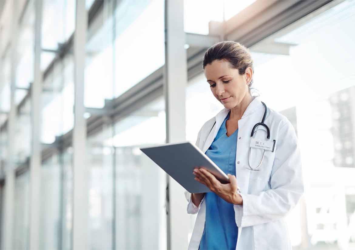 Provider looking down at clipboard