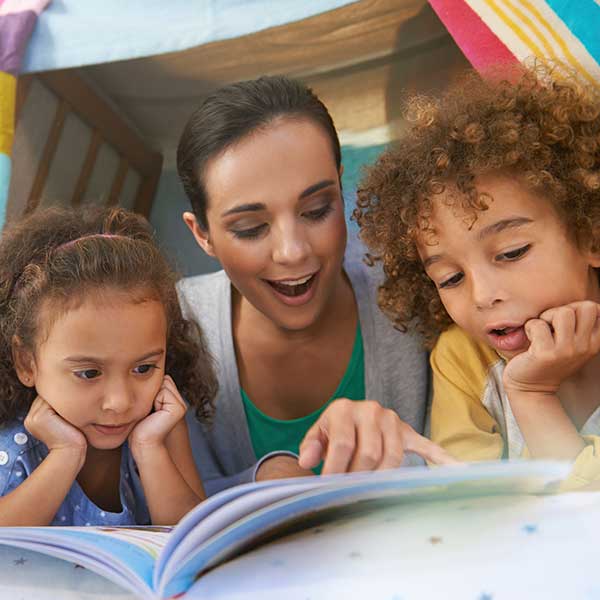 Mother reading to children