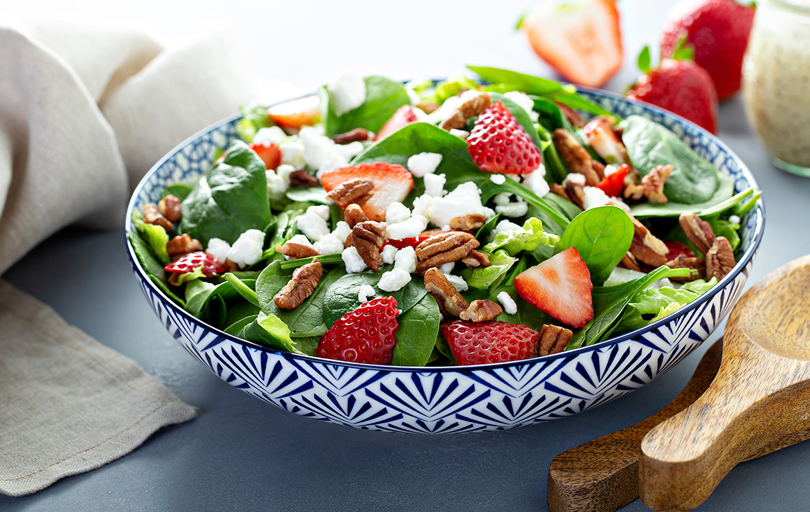 Bowl of salad on top of table