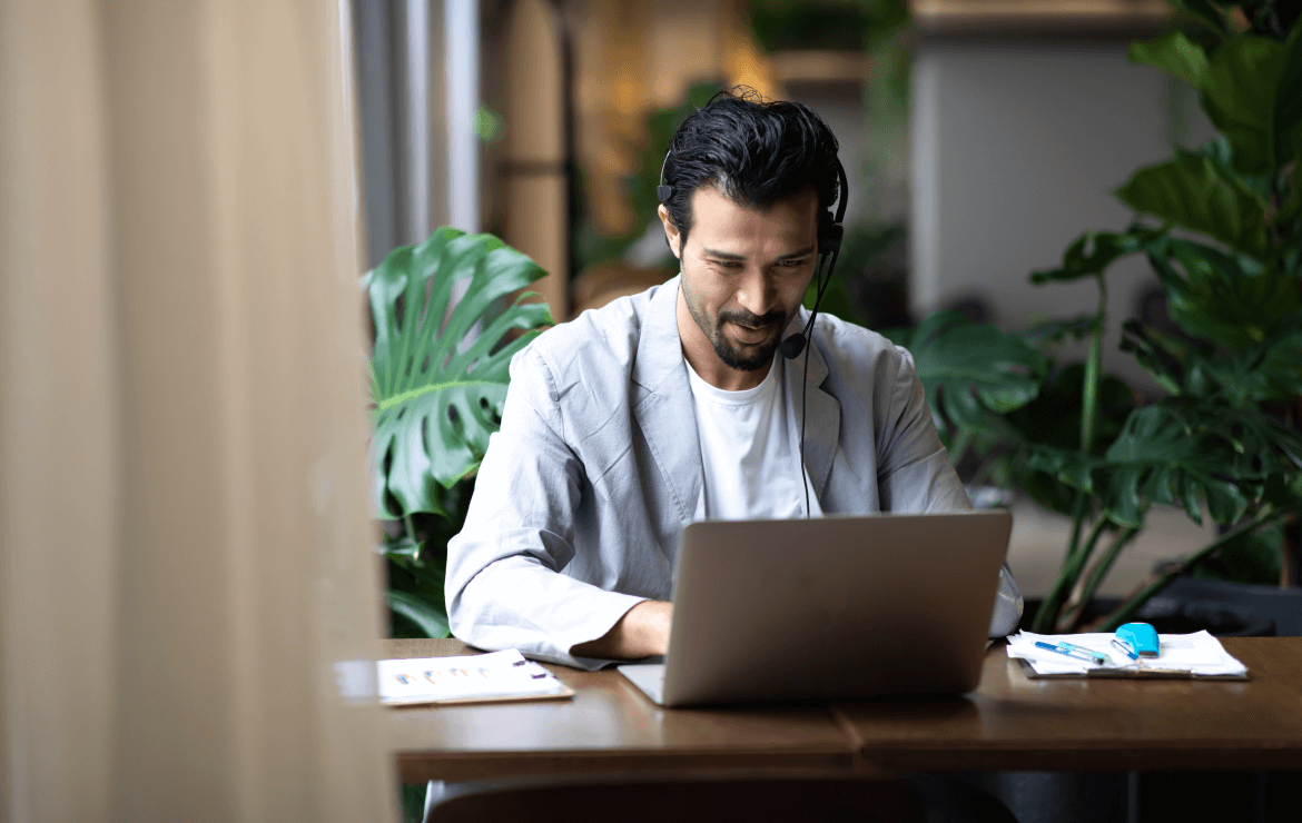 Broker wearing headset while on a video conference call