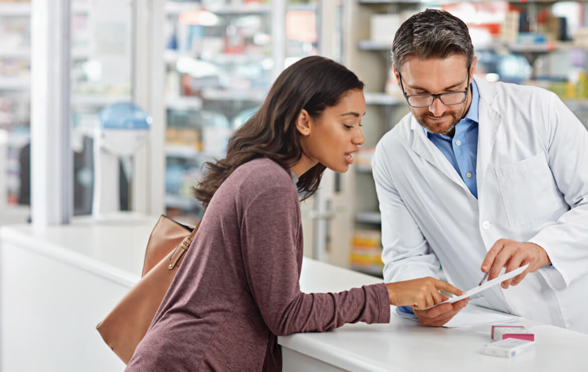 Doctor providing prescription to patient