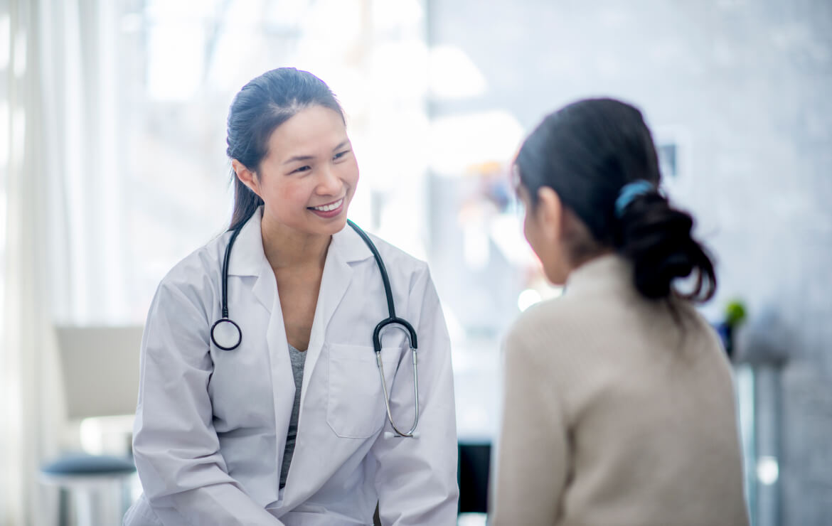 Doctor speaking with patient in office