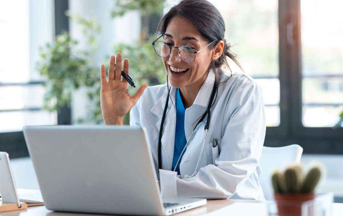 Doctor waving on telehealth call