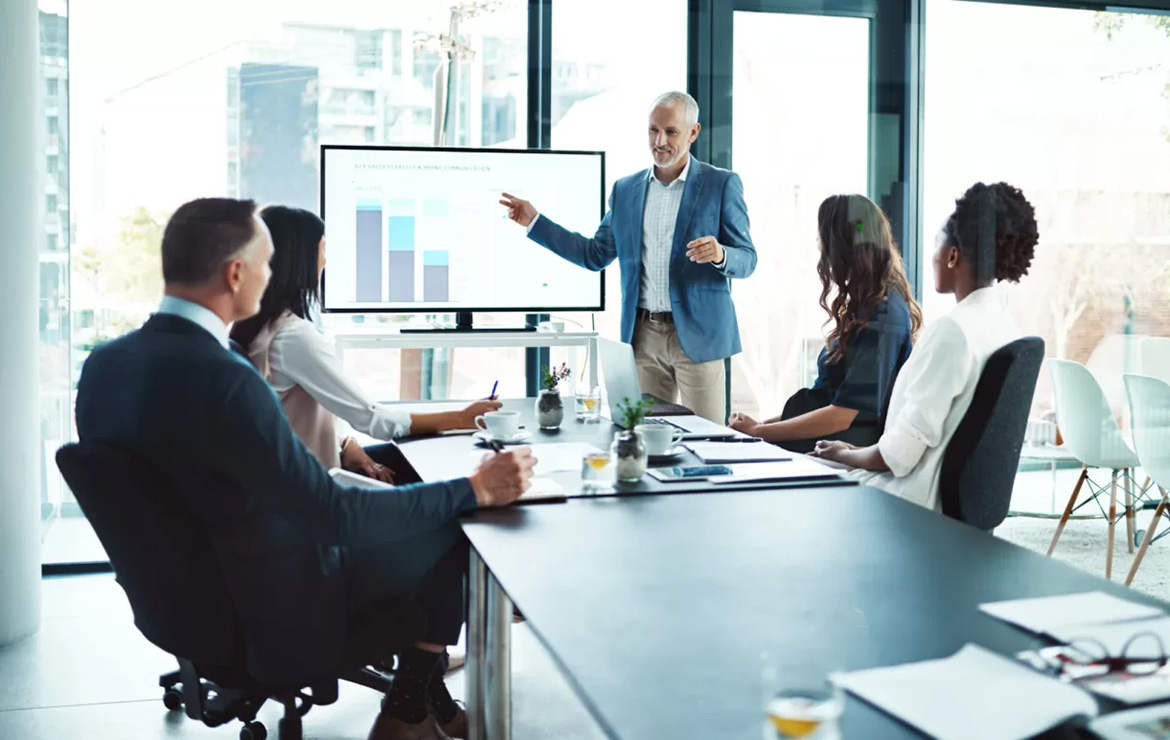Employees in business attire having meeting