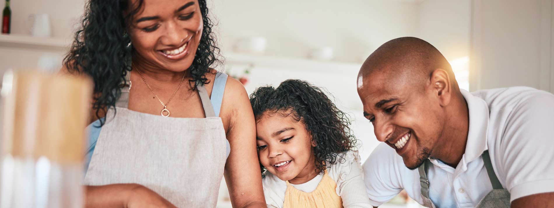 Family cooking together in kitchen