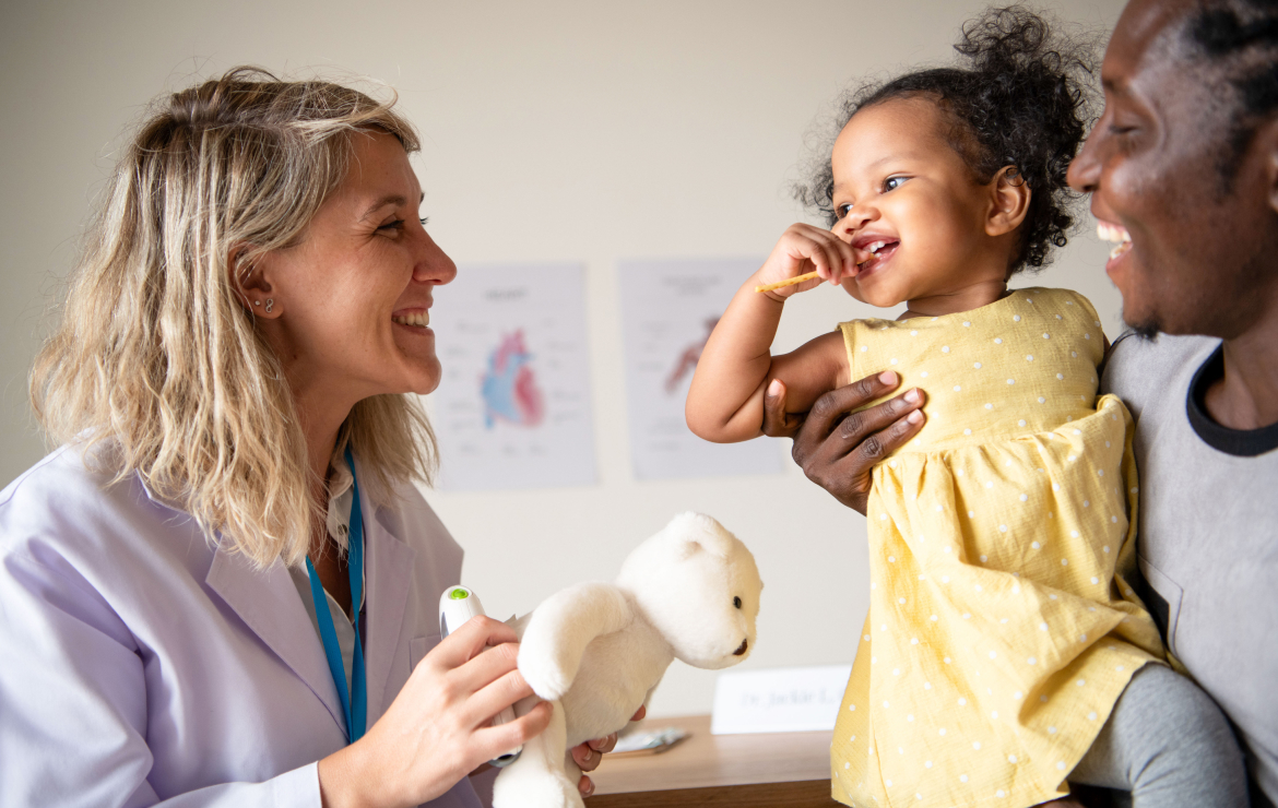 Father and daughter visiting with doctor
