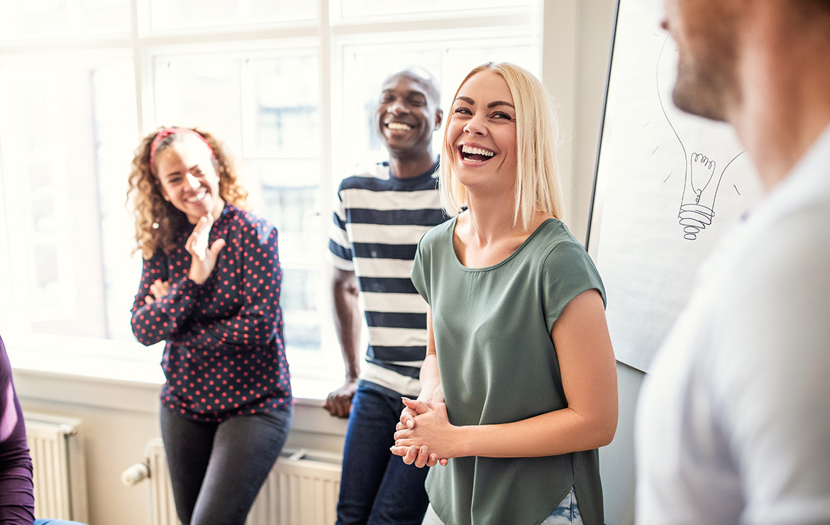 Group of adults smiling at each other