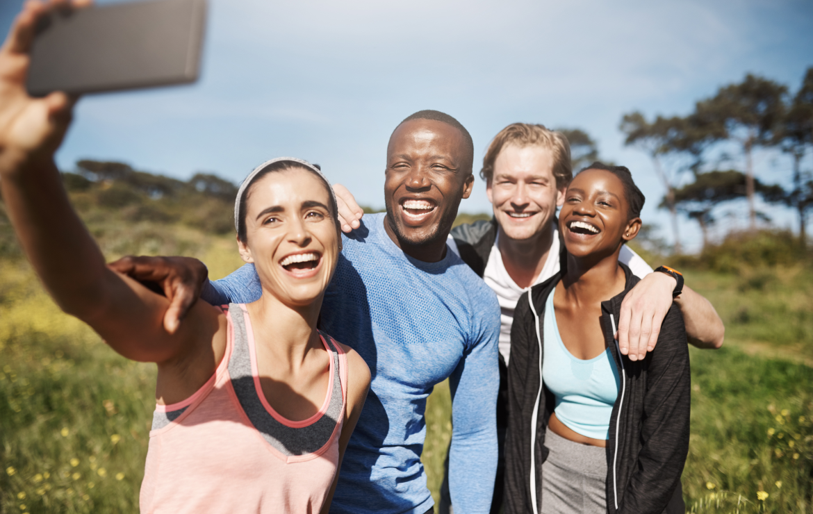 Group of friends taking selfie photo outside