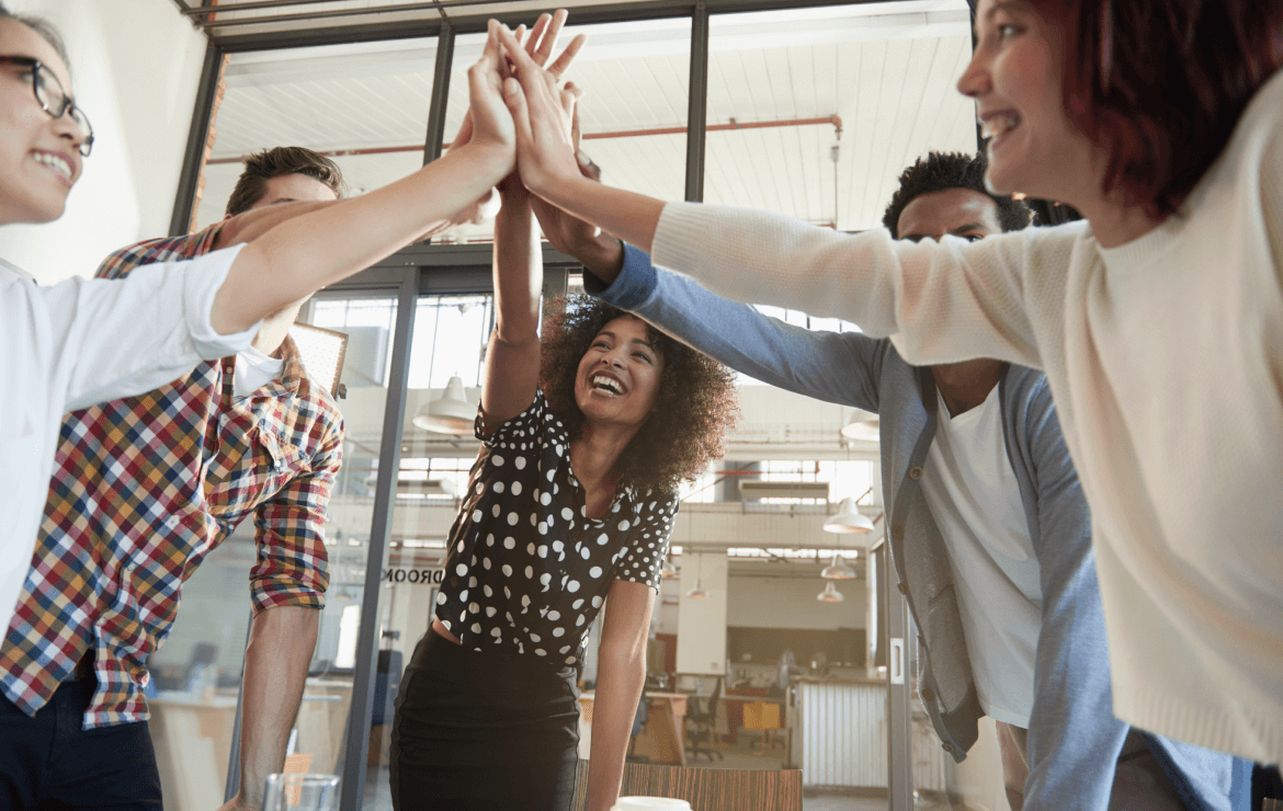 Group of people high fiving together