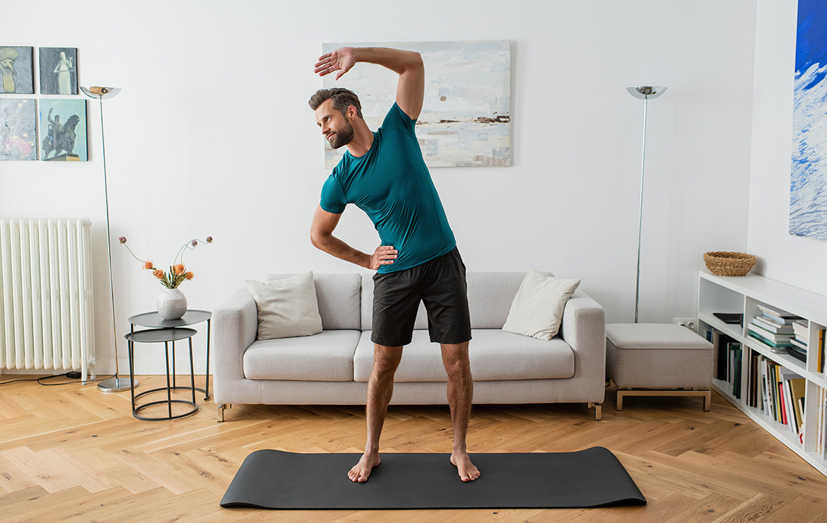 Man doing stretches at home