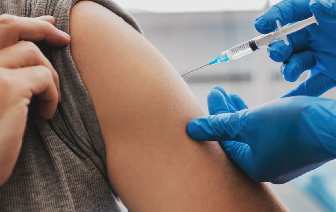 Person getting vaccinated in arm