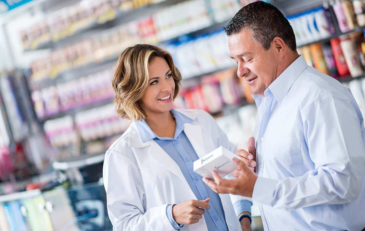 Pharmacist explaining medication to patient