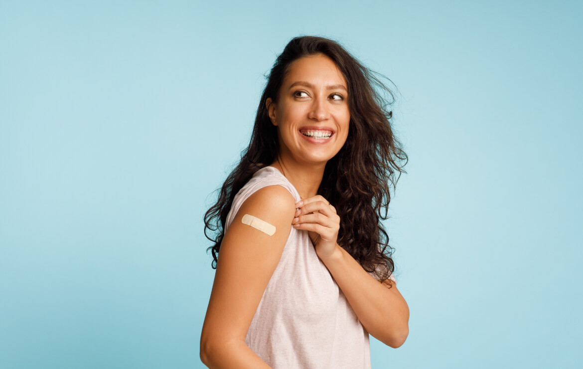 Woman smiling after receiving flu shot