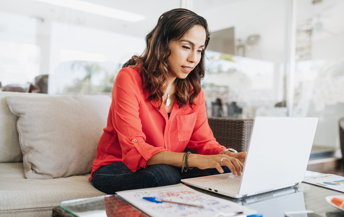 Woman working from home using laptop