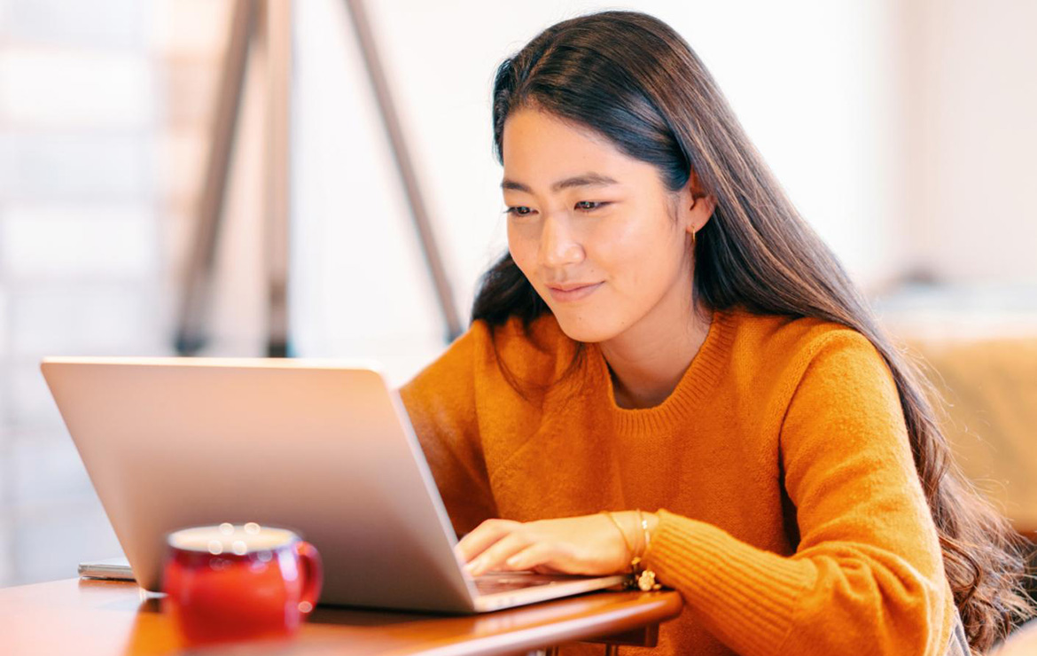 Young adult using laptop