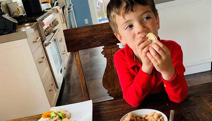 Young boy eating lunch