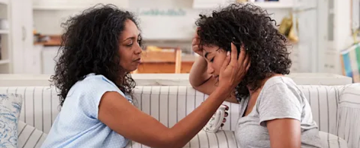 Woman consoling daughter