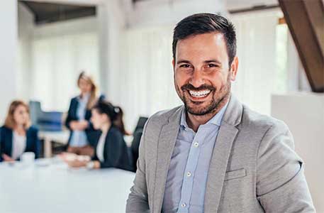 Employee smiling in conference room