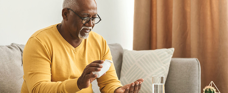 Senior man taking medication