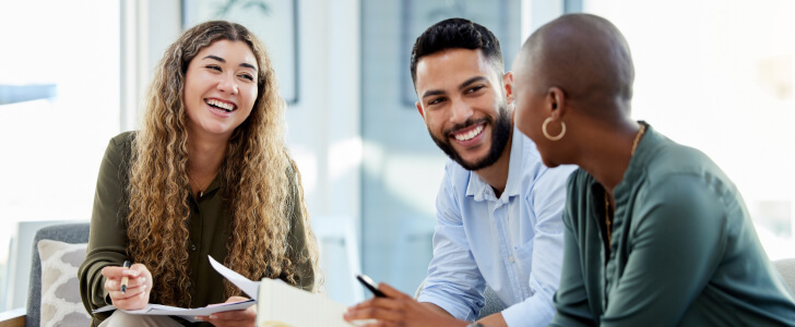 Happy businesspeople smiling together during meeting