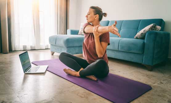 woman stretching on a yoga mat